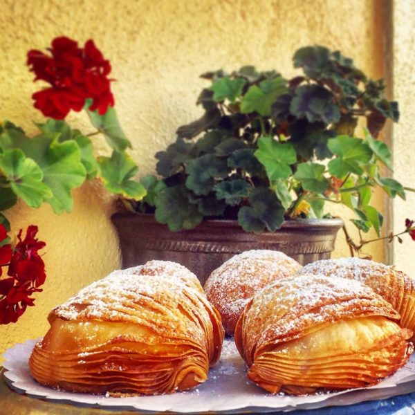 A shell-shaped, multi-layered pastry, filled with Crema Pasticciera